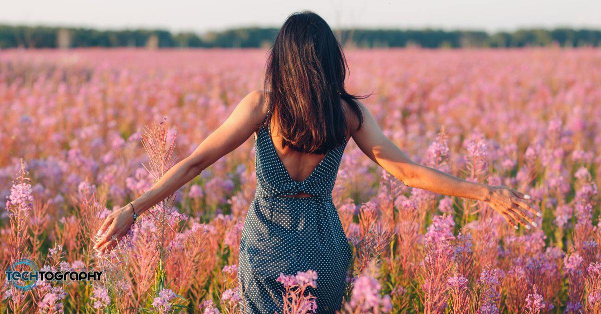 Lady walking on a flower field