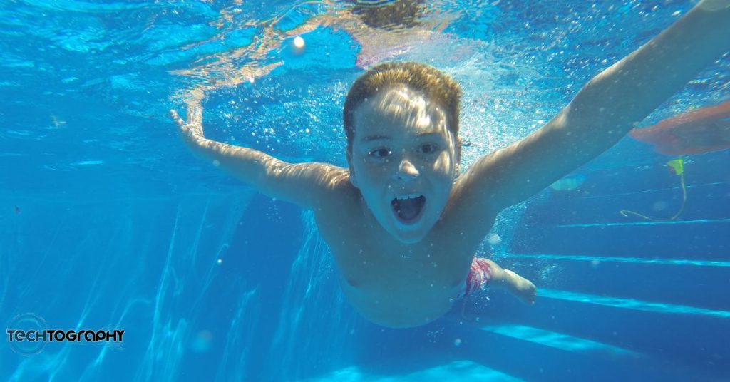 Underwater photo of a kid swimming